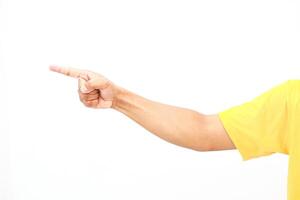 A directional arm gesture with yellow shirt, indicating a specific direction or guidance on a plain background photo