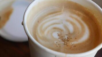 white sugar pouring from a in a paper packet on a coffee cup video