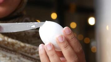 Expert slicing of a hard-boiled egg in a cozy kitchen setting video