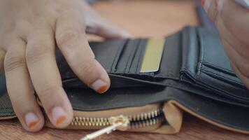 Exploring card organization in a black wallet with skillful hands video
