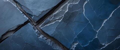 Rough surface of natural dark blue slate stone creating an abstract background with copy space photo