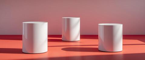 Three white cylinder podiums on red background photo