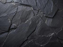 Dark black slate background texture showing rough surface. photo