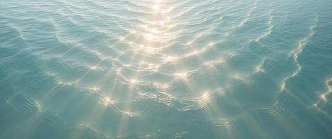 Mysterious ocean surface aerial view of underwater light rays and serenity. photo