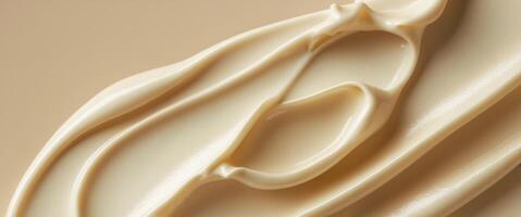 Closeup of Creamy Butter Texture on Beige Background Smooth Swatch for Beauty Skincare Design. photo