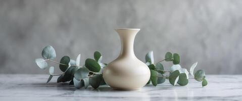 Elegant Cream Jar Displayed on Marble with Eucalyptus photo