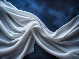 Elegant White Fabric Draped Over Deep Blue Surface for Luxury and Sophistication in Textile and Textile Design Projects. photo