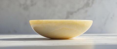 Smooth surface of polished yellow onyx stone creating a beautiful background for various design purposes photo