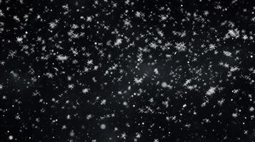 falling snow on black background photo