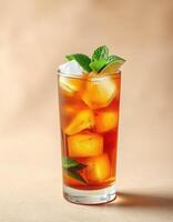 Refreshing iced tea drink with mint and lime served in a tall glass against a simple background photo