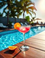 Refreshing cocktail by the swimming pool on a sunny tropical afternoon in a resort photo