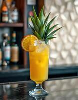 Colorful tropical cocktail served in a tall glass garnished with pineapple and lemon slices at a trendy bar photo