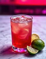 Refreshing cocktail garnished with lime served in a vibrant bar setting at night photo