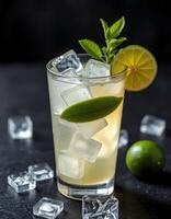 Refreshing cocktail with ice cubes, lime, and mint garnished on a dark backdrop photo