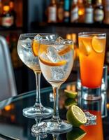 Refreshing cocktails served with citrus garnishes at a stylish bar during an evening gathering photo