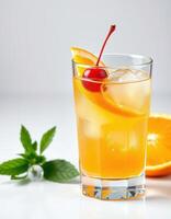 Refreshing citrus cocktail with cherry and mint garnish served in a clear glass during a sunny afternoon photo