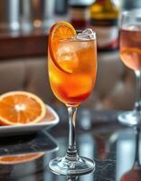 Bright and refreshing orange cocktail garnished with a slice, enjoyed at a chic bar photo