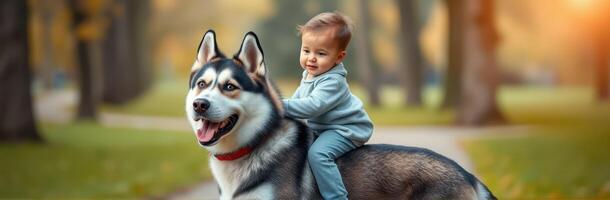 Child joyfully rides a husky dog along a peaceful park path during autumn afternoon photo