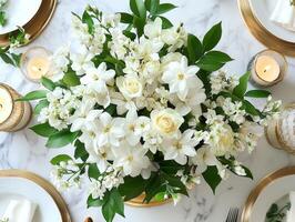 beautifully arranged floral centerpiece features fresh jasmine and roses in golden vase. Surrounding candles and lanterns enhance festive atmosphere for Eid al Fitr gatherings photo