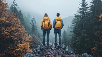 Two individuals stand apart on high cliff gazing each other amid vast chasm. Their expressions reveal mix of longing and uncertainty against breathtaking sunset backdrop photo