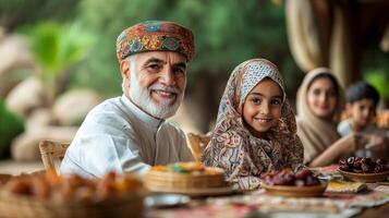 joyful Muslim family gathers around wooden table celebrate Eid al Fitr. They share dates sweets and enjoy colorful decorations in warm inviting atmosphere photo