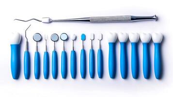 A collection of dental tools arranged neatly on a white background for professional use photo