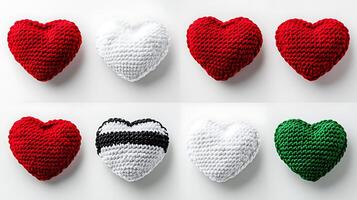 A collection of colorful, knitted heart-shaped cushions arranged in a grid pattern photo