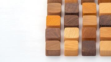 A collection of wooden blocks arranged in a grid pattern on a light background, showcasing various shades photo
