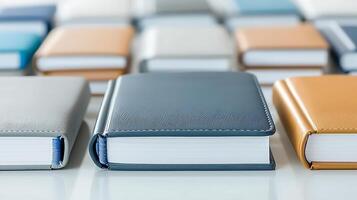 A row of books on a white surface photo