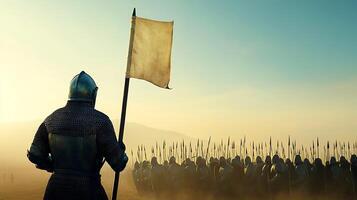 A man in armor holding a flag in front of a group of soldiers photo