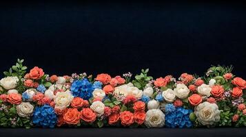 A row of red, white and blue flowers on a black background photo