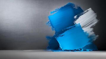 Blue paint on a wall with a gray background photo