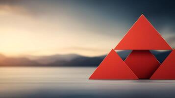 A red triangle is sitting on top of a table photo