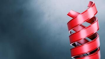 A red spiral is sitting on top of a table photo