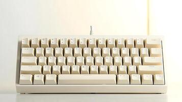 A white computer keyboard with a white light behind it photo