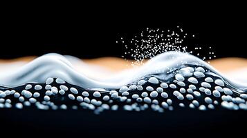 A wave of bubbles is shown on a black background photo