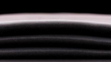 A stack of black sheets on a black background photo