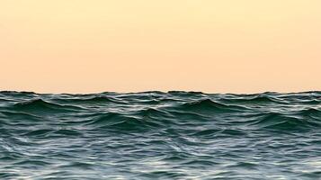 A view of the ocean at sunset with waves photo