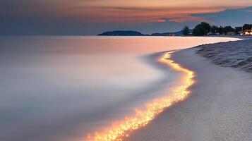 A beach at sunset with a long line of fire photo
