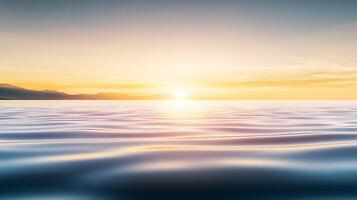 Sunset over the ocean with waves and mountains photo
