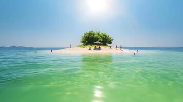 An island with a small tree on it in the middle of the ocean photo