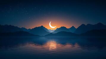 A crescent moon and a mountain range at night photo