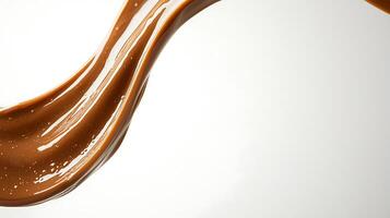 A chocolate liquid is being poured into a glass photo