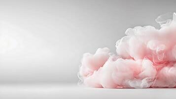 A pink cloud of smoke is sitting on a white surface photo