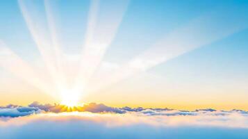Sun shining over clouds with sun rays photo