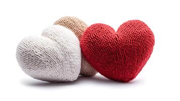 Three heart shaped pillows on a white background photo