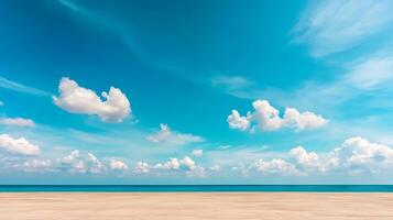 An empty beach with a blue sky and clouds photo