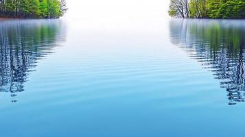 A lake with trees and water in the background photo