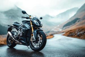 Powerful motorcycle parked on a scenic mountain road during a misty day photo