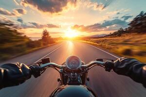 Biker riding custom motorcycle on an open road at sunset enjoying freedom and speed photo